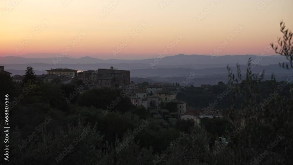 View of sunrise over Tuscan landscape and Chianciano Terme, Province of Siena, Tuscany, Italy View of sunrise over Tuscan landscape and Chianciano Terme, Province of Siena, Tuscany, Italy