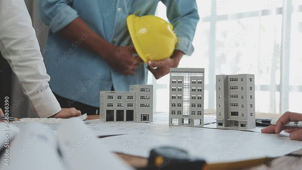 Architectural engineer team meeting Use of blueprints, construction drawings and calculations for architectural projects and engineering tools in the workplace technical structure concept.
