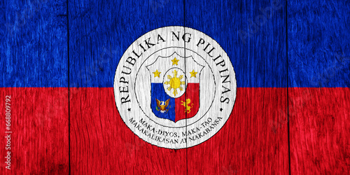 Flag and coat of arms of Republic of the Philippines on a textured background. Concept collage. photo
