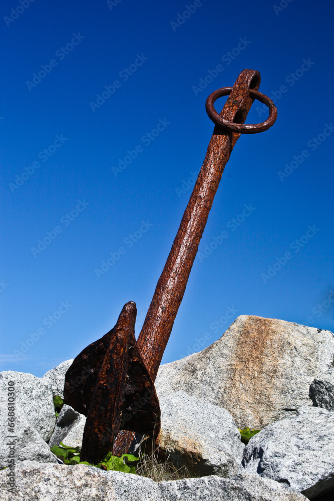 Old rusty Anchor at the Shore