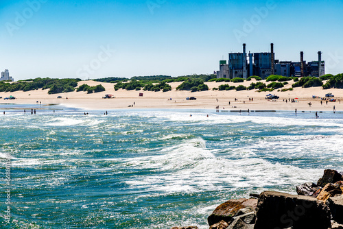 Necochea city, Buenos Aires, Argentina. View of the town skyline and the beach from the harbor pier. photo