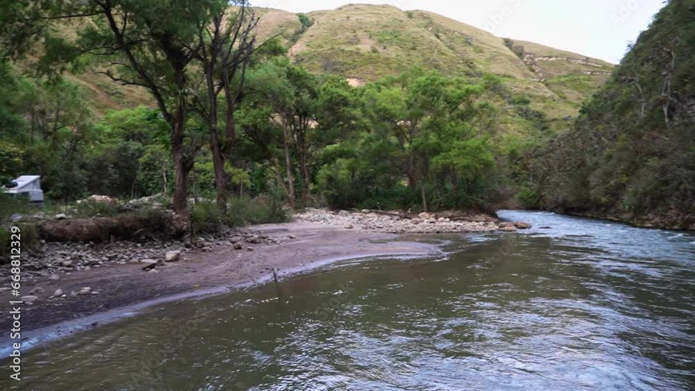 small lively river flowing through a gorge in the andes on the way towards the historical archeological site of the tombs of Revash. small lively river flowing through a gorge in the andes on the way towards the historical archeological site of the tombs of Revash.