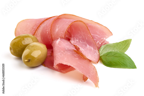 Smoked meat slices with basil, isolated on white background.