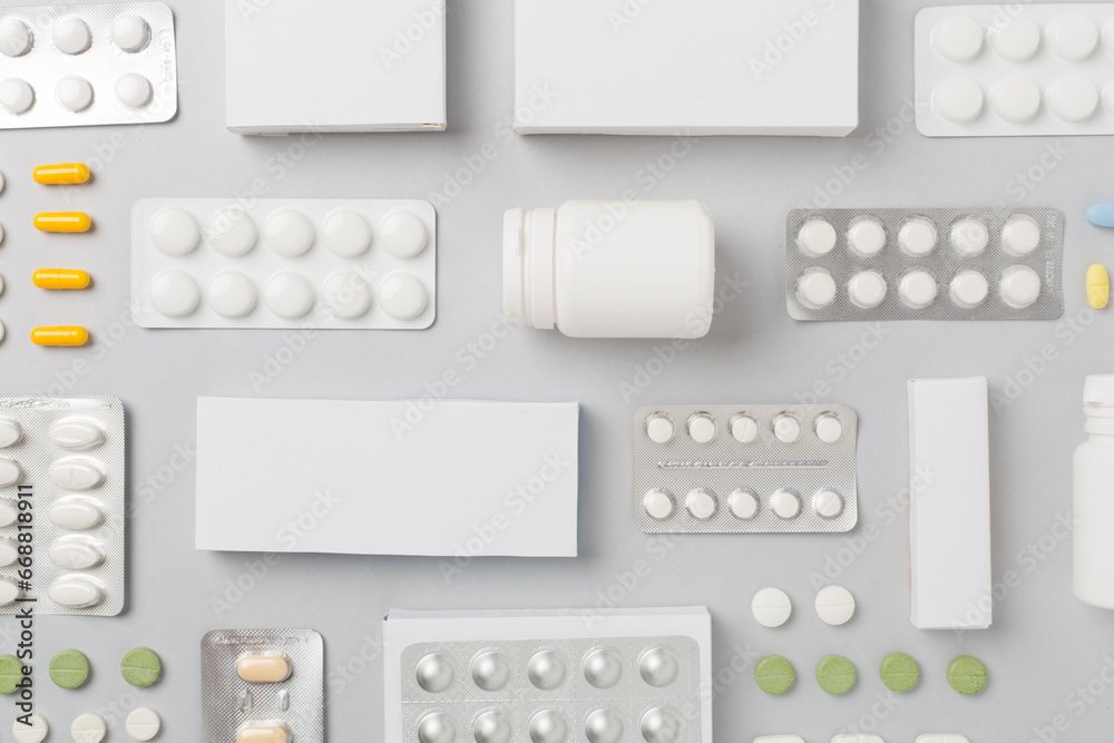 Flat lay with different pills in blister packaging and boxes and on color background - obrazy, fototapety, plakaty 