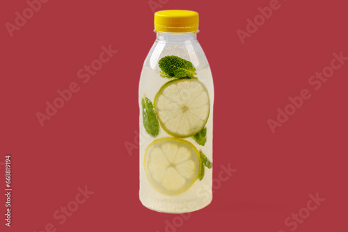 Mojito lemonade with lemon, lime, mint, mojito syrup, ice, sparkling water on red background for food delivery website2 photo