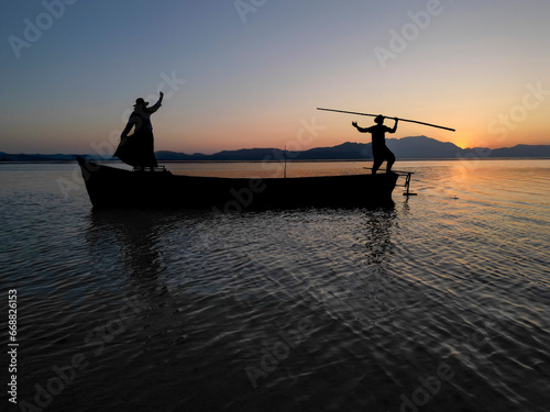 The harmonious, motivational and energetic movements of fishermen couples and their time going to work