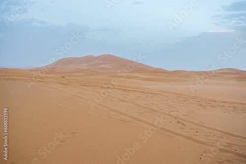 Sand dunes during sunset in Erg Chebbi desert, near Merzouga, Sahara Desert, in Morocco.