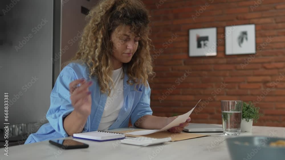 Caucasian woman at home use calculator to calculate expenses and taxes Caucasian woman at home use calculator to calculate expenses and taxes