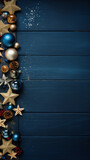 steel blue wooden background with empty space with Christmas ornaments on the left. copy space frame