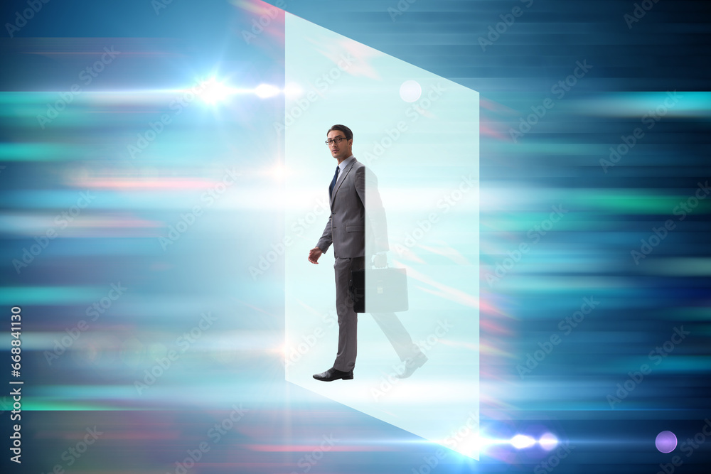 Businessman entering virtual world in business concept Businessman entering virtual world in business concept