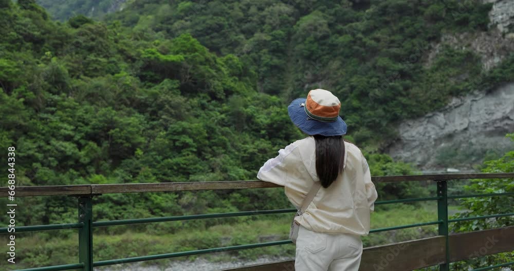Hiking woman enjoy the scenery view in forest Hiking woman enjoy the scenery view in forest