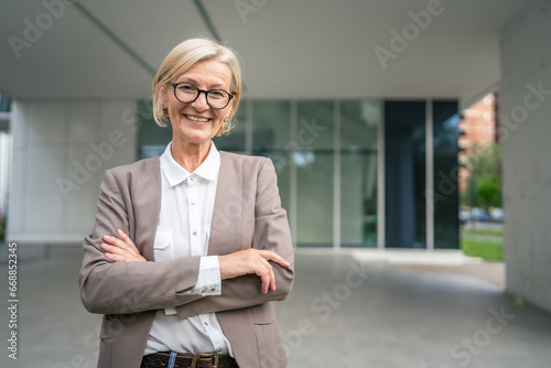 Wallpaper Mural Portrait of one caucasian blonde mature businesswoman stand outdoor Torontodigital.ca