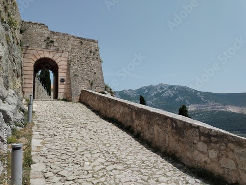 fortress in the sea the wall klis fortress in split Croatia downtown medieval town streets and buildings highlights  photo