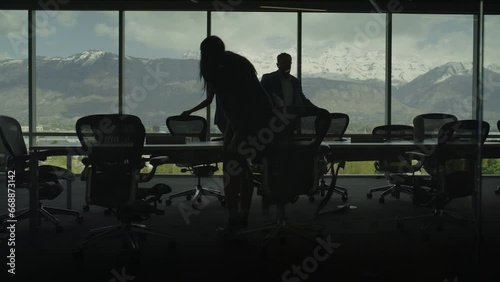 Silhouette of business people entering conference room with scenic view / Pleasant Grove, Utah, United States