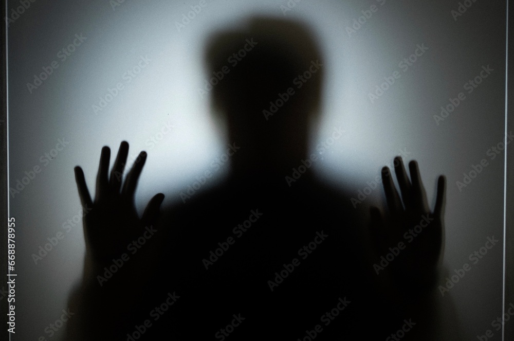 silhouette of a person in the darkness