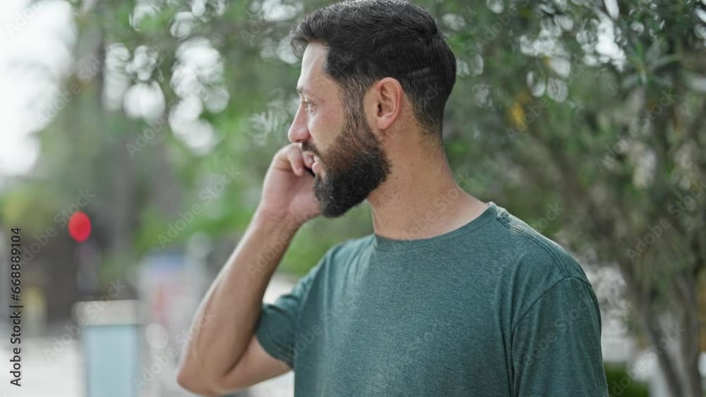Young hispanic man smiling confident talking on the smartphone at park Young hispanic man smiling confident talking on the smartphone at park