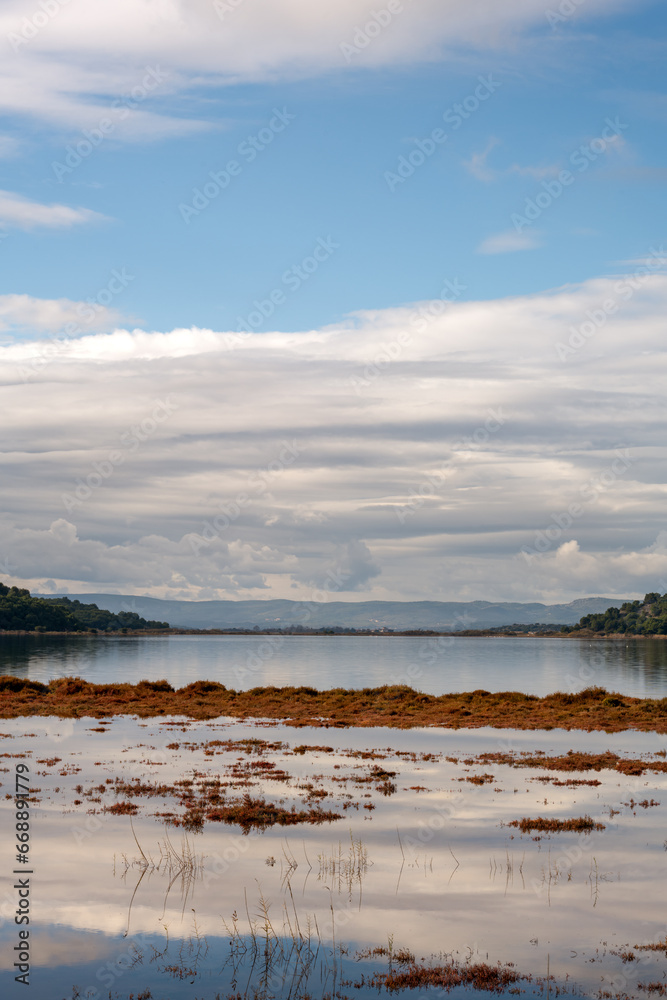 View of Gruissan lake on an autumn cloudy day, aude, Occitania, South of France View of Gruissan lake on an autumn cloudy day, aude, Occitania, South of France