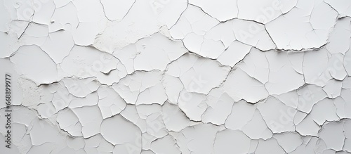 Cracked white paint with texture in the background