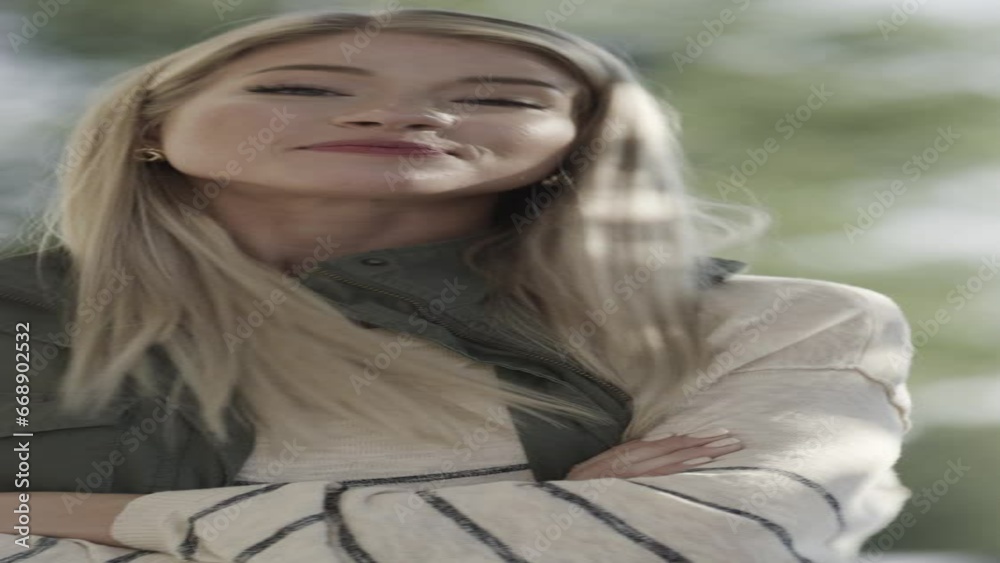 Slow motion close up portrait of smiling confident woman outdoors - vertical / Pleasant Grove, Utah, United States Slow motion close up portrait of smiling confident woman outdoors - vertical / Pleasant Grove, Utah, United States