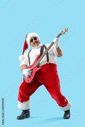 Cool Santa Claus playing gu...
