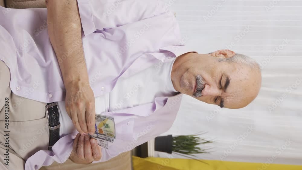 Vertical video of Consistent guy who saves money. Vertical video of Consistent guy who saves money.