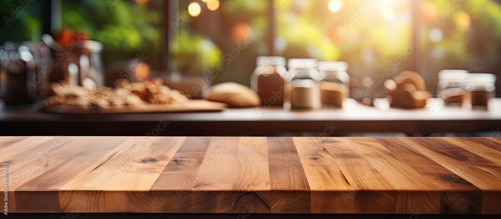 Blurred background with wood table top and daylight flare showcasing kitchen interior products