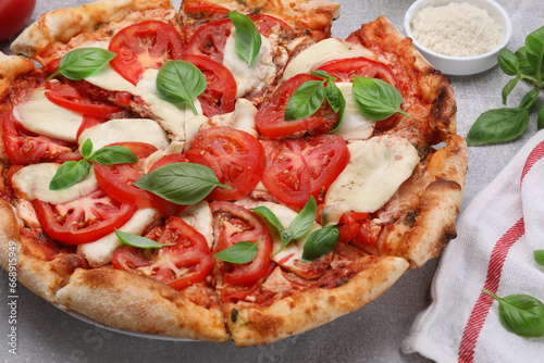 Delicious Caprese pizza on grey table, closeup