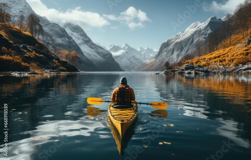 Person rowing on a calm lake in autumn, aerial view only small boat visible with serene water around