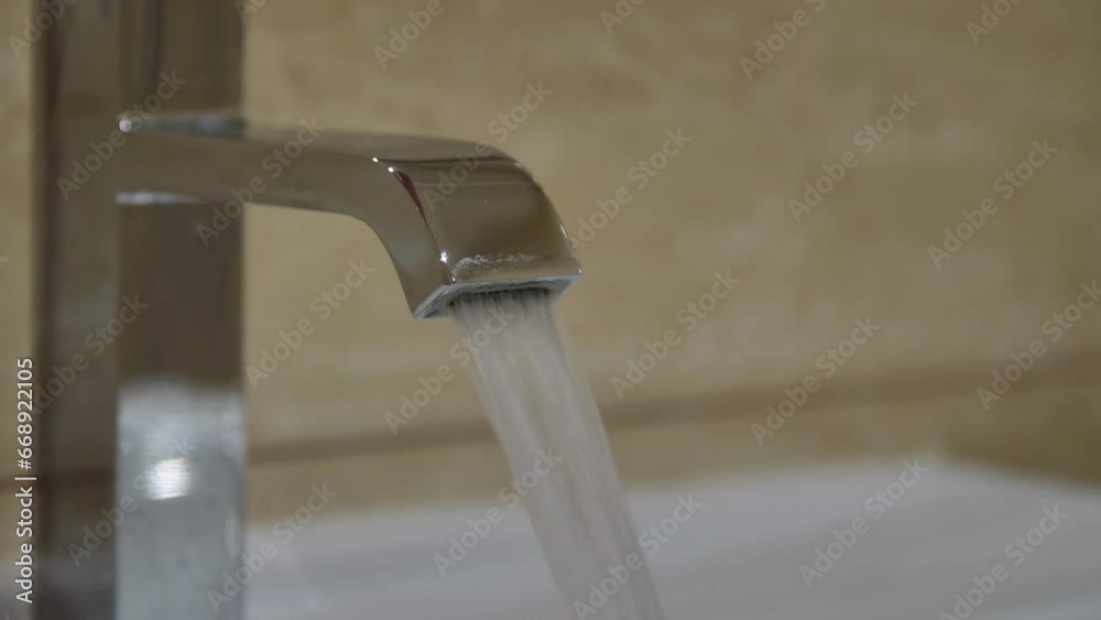 shuts off the water flowing from the faucet into the bathroom sink. shuts off the water flowing from the faucet into the bathroom sink.