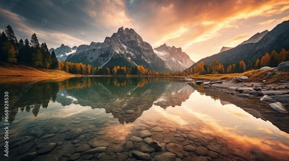 Beautiful view of the lake in the mountains with the reflection of the sky at sunrise