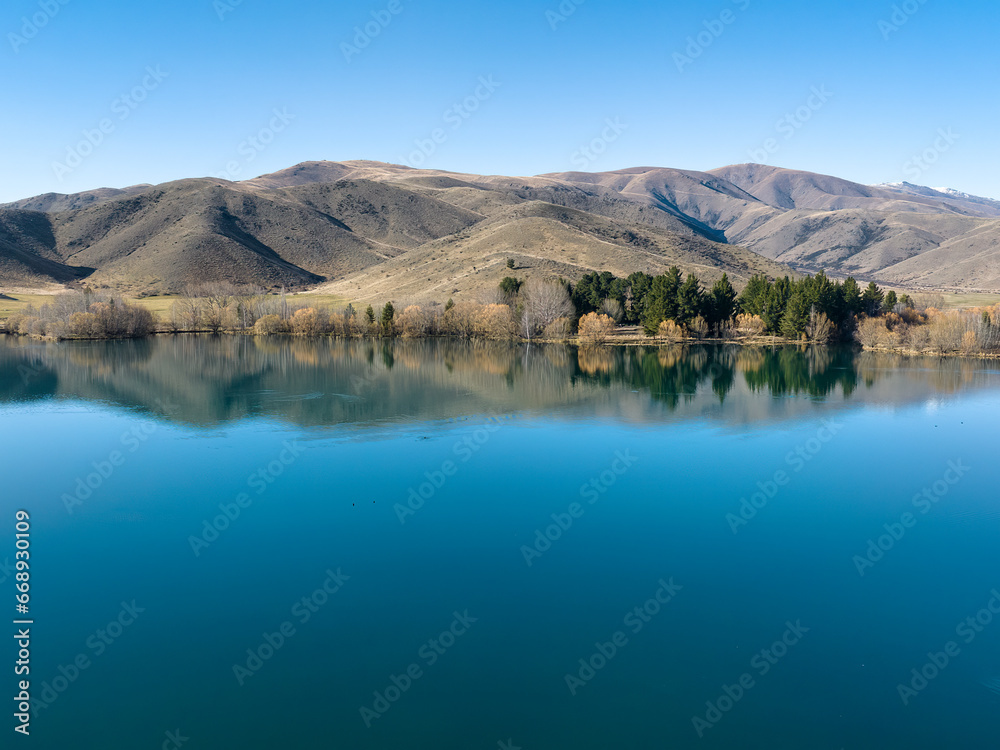 Views of the tranquil Wairepo arm lagoon which is part of Lake Ruataniwha near the village of Twizel at dawn