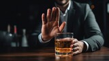 man refuses say no and avoid to drink an alcohol whiskey , stopping hand sign male, alcoholism treatment, alcohol addiction, quit booze, Stop Drinking Alcohol. Refuse Glass liquor, unhealthy, reject
