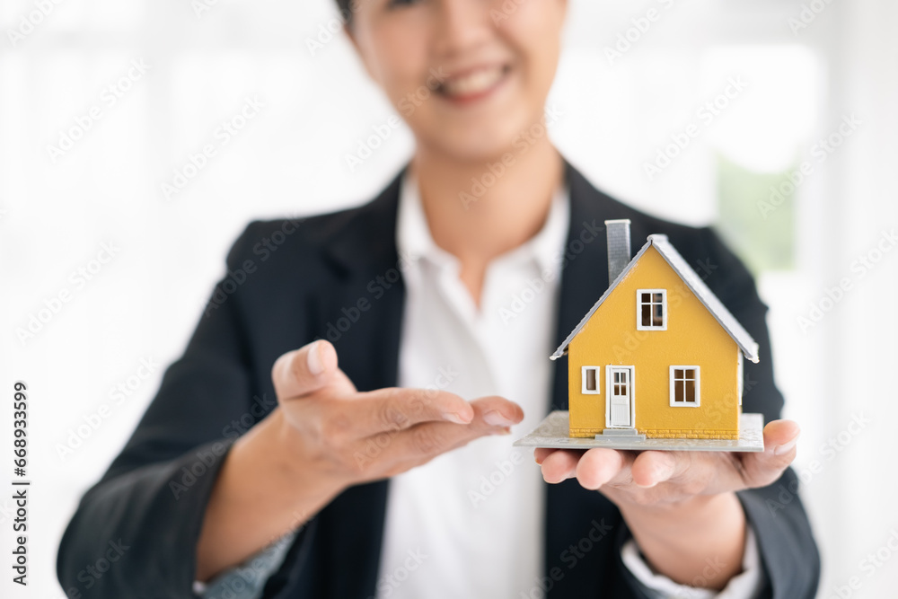 real estate agents talk about renting or buying a home in the office. real estate agents talk about renting or buying a home in the office.