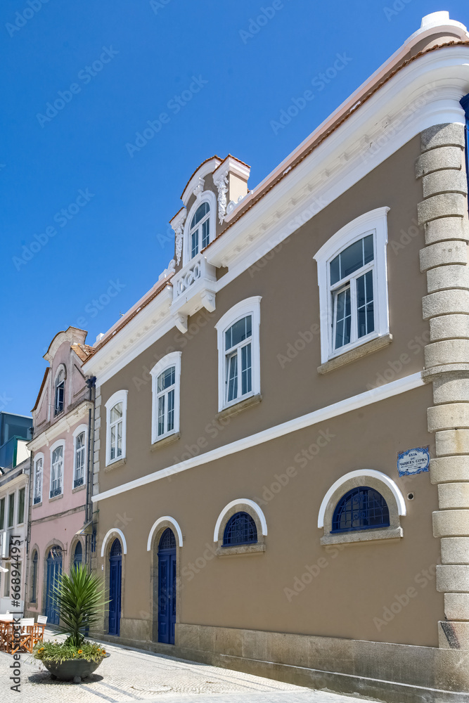 Fototapeta premium Aveiro, beautiful city in Portugal, old blue house with azulejos, on the canal, in the historical center 