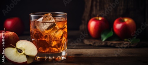 Traditional apple drink on a rustic background Focused
