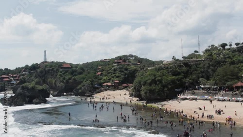 The video sof  Gunungkidul Beach name Baron in Indonesia, renowned for its white sandy shores, clear waters, limestone cliffs, and serene atmosphere, making it a perfect for nature lovers