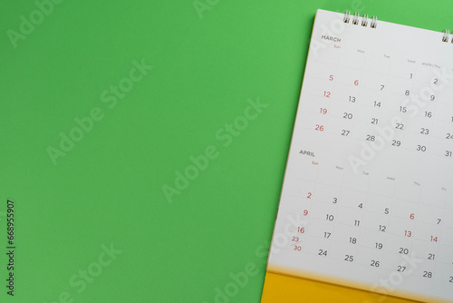 close up of calendar on the colorful table background, planning for business meeting or travel planning concept