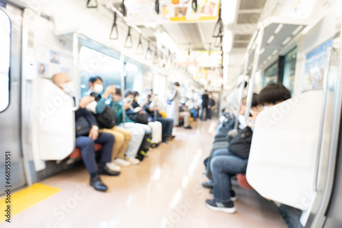 Blurred abstract background of people on Tokyo subway train photo