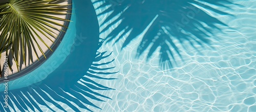 Tropical themed product display with luxurious pool and palm trees viewed from above