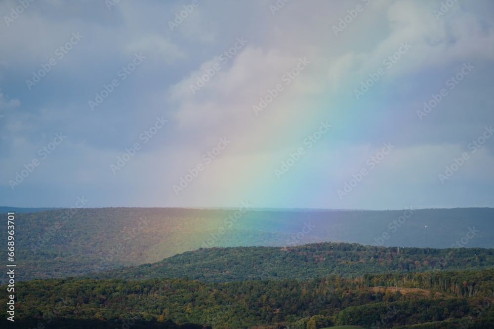 A rainbow formed near the Hawk Mountain, Hamburg, Pennsylvania, U.S