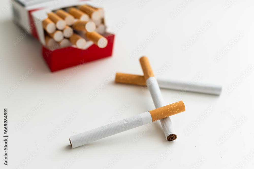 cigarettes form as three crosses on white background cigarettes form as three crosses on white background