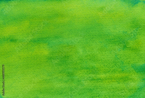 紙の質感が感じられる鮮やかで明るいグリーン背景