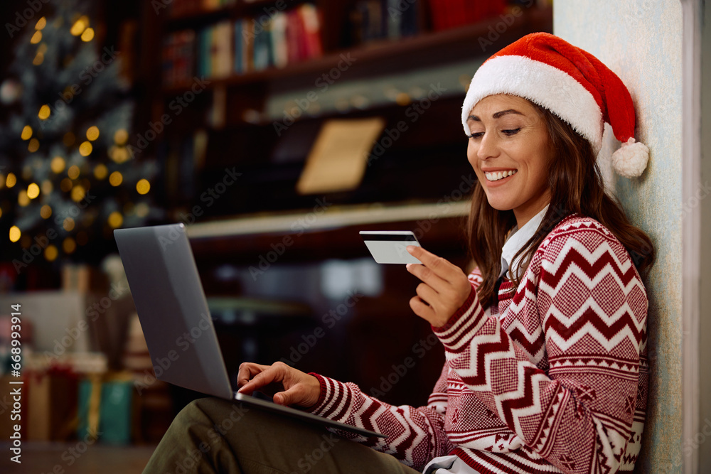 Happy woman enjoys in online shopping on Christmas at home Happy woman enjoys in online shopping on Christmas at home