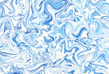 白い滴を飛ばしたアクティブなイメージの青色マーブル模様背景