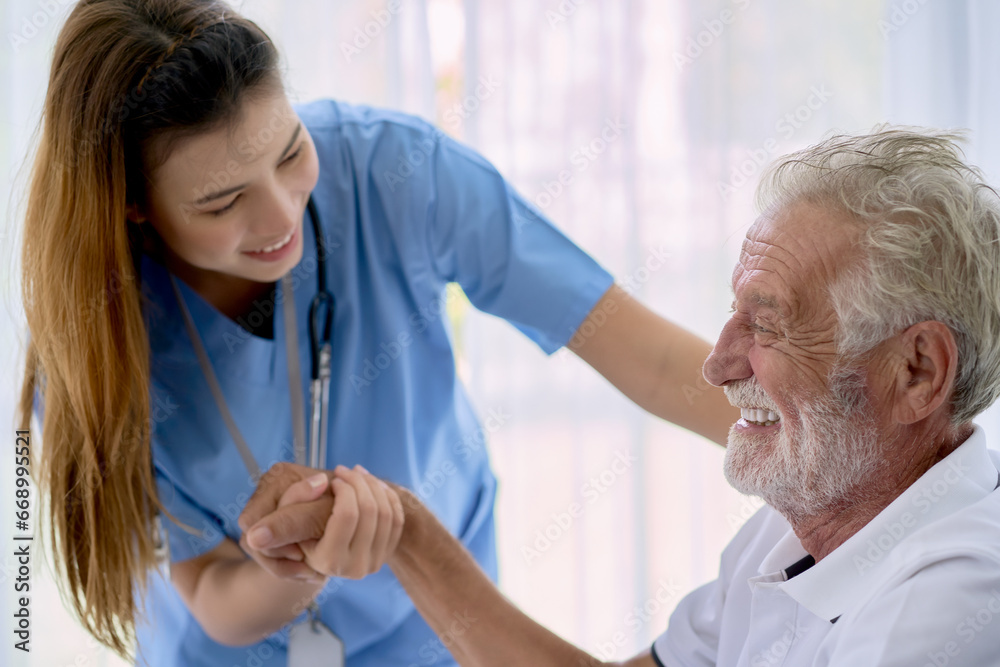 Obraz premium A old patient smile for happy from home healthcare service with a nurse to take care.