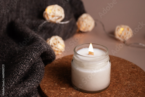Candle in home interior with warm lights, calming glow, Spa Relaxation, Aromatic decor