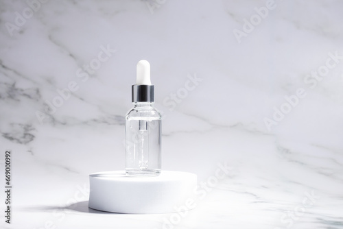 anti aging face serum in a bottle on the podium on a marble background