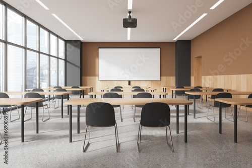 Beige and gray classroom interior with projection screen photo
