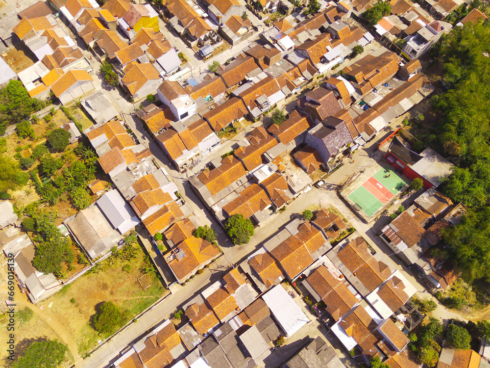 Drone Photography. Aerial Landscape Dense Residential Neighborhood at the top of Pangradinan Mount in the morning, Bandung - Indonesia. Aerial Photography