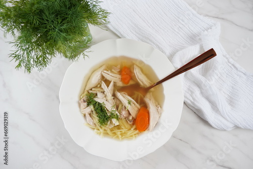 Chicken soup, chicken broth, with pieces of chicken and vegetables. Chicken bouillon, boiled meat